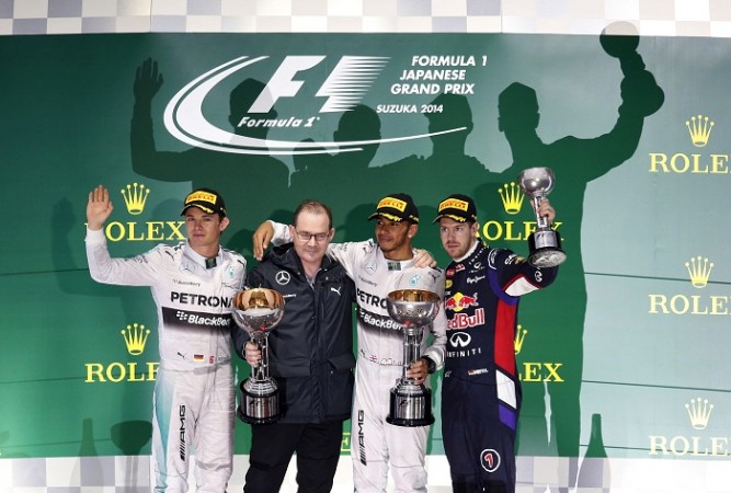 The celebrations at the Japanese Grand Prix podium were mured following a serious accident to Jules Bianchi Nico Rosberg Lewis Hamilton Sebastian Vettel