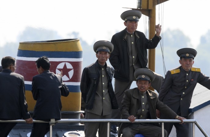 North Korean soldiers are seen on a boat on the banks of the Yalu River, near the North Korean town of Sinuiju, opposite to the Chinese border city of DandongJacky Chen/Reuters