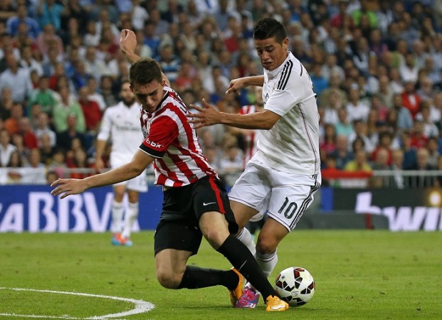 Athletic Bilbao defender Aymeric Laporte fights for possession with Real Madrid playmaker James Rodriguez during their La Liga game Aymeric Laporte Athletic Bilbao James Rodriguez Real Madrid