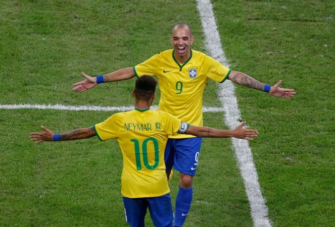 Diego Tardelli celebrates with Brazil teammate Neymar after scoring against Argentina Diego Tardelli Neymar Brazil