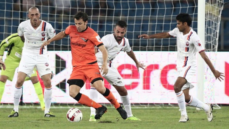 Delhi Dynamos forward Alessandro Del Piero is surrounded by FC Pune City defenders during their ISL game Alessandro Del Piero Delhi Dynamos FC Pune City
