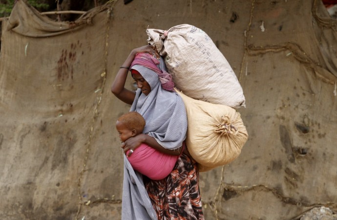 On World Food Day 2014, lets have a look at 8 facts and 5 quotes that will melt your heart. (Photo: A displaced Somali woman carries a child and her belongings as she arrives at a temporary dwelling) On World Food Day 2014, lets have a look at 8 facts and 5 quotes that will melt your heart.