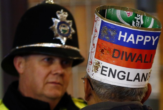 A man speaks to a police officer during Diwali celebrations in Leicester. Diwali outside India