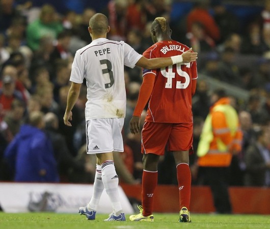 Liverpool striker Mario Balotelli walks off the field at halftime with Real Madrid defender Pepe before swapping shirts in their Champions League game Pepe Mario Balotelli Liverpool Real Madrid