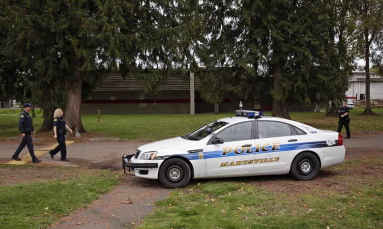 Marysville Shooting: Teacher Megan Silbergerger, ran into the cafeteria room and Confronted teen gunman Jaylen Fryburg. (Photo: Police officers walk on the campus at Marysville-Pilchuck High School during an investigation following a shooting at the school in Marysville, Washington October 24, 2014.) Marysville Shooting: Teacher Megan Silbergerger, ran into the cafeteria room and Confronted teen gunman Jaylen Fryburg.
