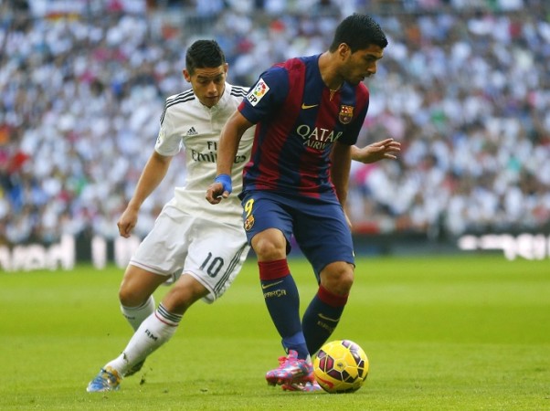 James Rodriguez and Luis Suarez battle for the ball in their El Clasico Luis Suarez Barcelona James Rodriguez Real Madrid