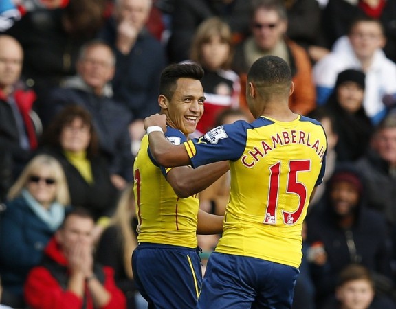Arsenal midfielder Alex Oxlade-Chamberlain compared teammate Alexis Sanchez to Barcelona forward Luis Suarez Alexis Sanchez Alex Oxlade-Chamberlain Arsenal