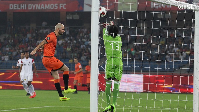 Delhi Dynamos' Hans Mulder tries to head the ball past NorthEast goalkeeper Rehenesh Delhi Dynamos vs NorthEast United FC
