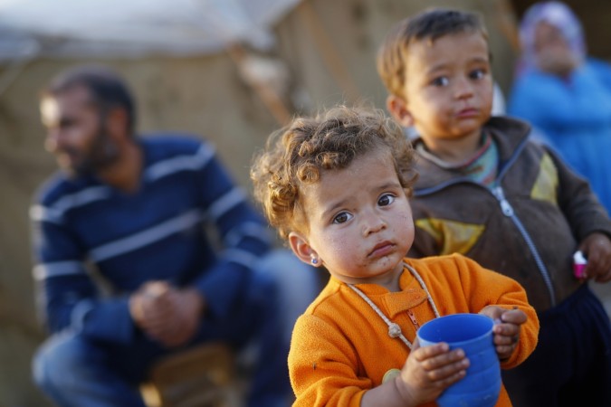ISIS News: Militants in Syria forced Kurdish children as young as 14 to watch horrifying videos of beheadings and beat them with cables. (Representational Picture) ISIS News: Militants in Syria forced Kurdish children as young as 14 to watch horrifying videos of beheadings and beat them with cables.