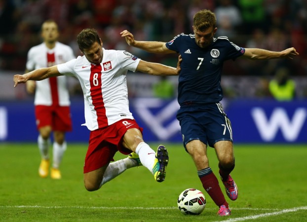 Poland's Grzegorz Krychowiak (L) has been doing great things with Sevilla this season. Grzegorz Krychowiak