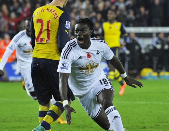 Swansea City's Bafetimbi Gomis celebrates his goal during their English Premier League match against Arsenal at the Liberty Stadium in Swansea, Wales November 9. Swansea City vs Arsenal