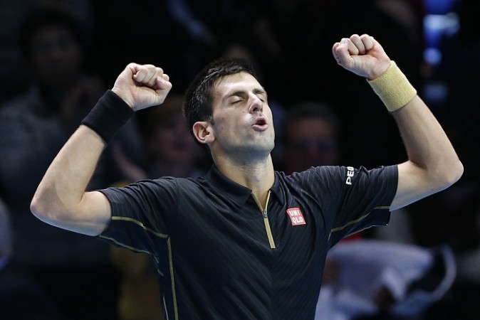 Novak Djokovic celebrates after defeating Stanislas Wawrinka in the ATP World Tour Finals Novak Djokovic ATP World Tour Finals