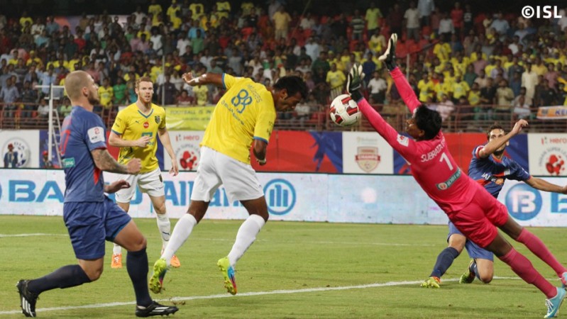 Kerala Blasters' Miraglas Gonsalves tries to score past Mumbai City's Subrata Paul during the two side's clash in Kochi Kerala Blasters vs Mumbai City
