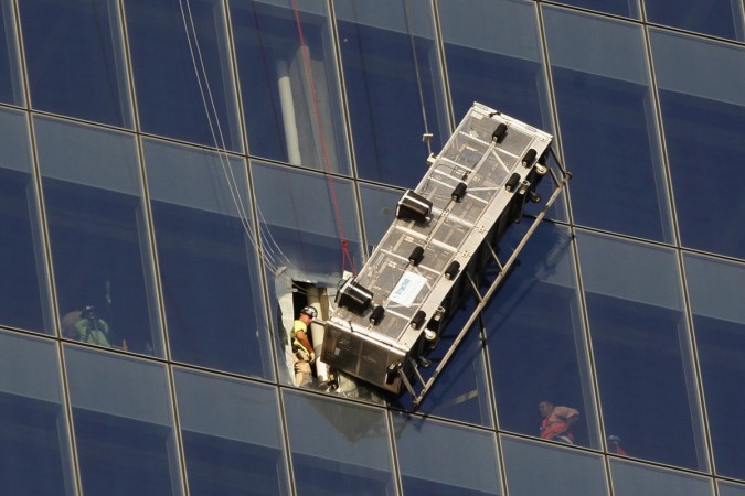 The scaffold workers were reportedly trapped on a hanging scaffold after a cable supporting the apparatus became loose. In a dramatic World Trade Center Rescue, two window washers dangling nearly 70 stories above ground were saved by firefighters.