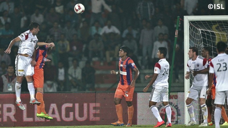 NorthEast United's Joan Capdevilla (L) tries to head the ball towards goal from a free-kick during his side's ISL clash against FC Pune City. NorthEast United FC vs FC Pune City