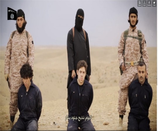 Photo: The Peter Kassig beheading video shows Jihadi john leading Americna aid worker's killing along with a gruesome mass execution of 16 other Syrian soldiers.
