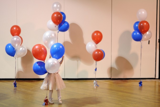 A boy dressed as Superman plays with a bubble machine at the Flint family's annual Halloween block party in Silver Spring, Maryland October 31, 2014