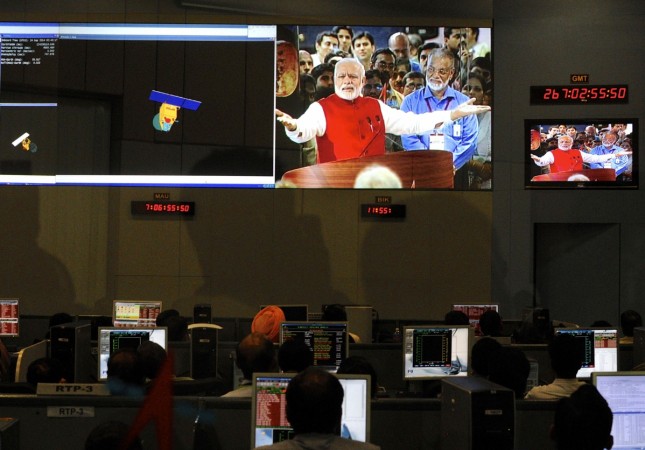 ISRO scientists and engineers watch Prime Minister Narendra Modi on screens after India's Mars orbiter successfully entered at their Spacecraft Control Center in Bangalore on 24 September 2014. ISRO will be conferred the Indira Gandhi Prize for Peace, Disarmament and Development for 2014 in recognition of its contribution in strengthening international cooperation in peaceful use of outer space. ISRO will be conferred the Indira Gandhi Prize for Peace, Disarmament and Development