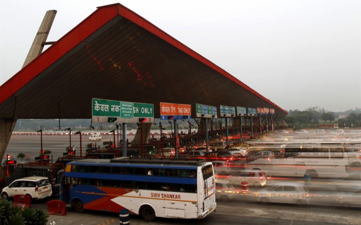 Vehicles pass through a toll plaza in Gurgaon. Toll booth violence