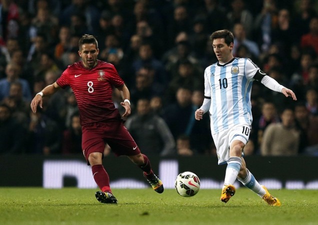 Portugal midfielder Joao Moutinho battles for the ball with Argentina forward Lionel Messi in their international friendly Joao Moutinho Portugal Lionel Messi Argentina
