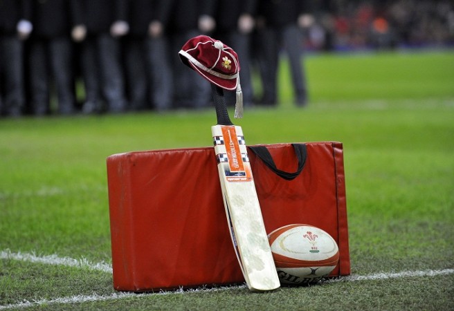 A cricket bat and cap are placed in tribute to Phil Hughes ahead of the rugby match between Wales and South Africa Phil Hughes Australia South Africa Rugby Cricket Bat Cap