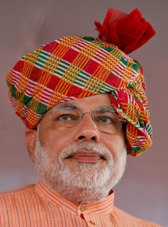 Modi attends an election campaign rally ahead of the state assembly elections at Fagvel village in Gujarat on 11 October 2012. Modi