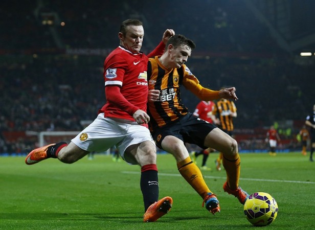 Hull City defender Andrew Robertson challenges Manchester United forward Wayne Rooney for the ball in their English Premier League clash Wayne Rooney Manchester United Andrew Robertson Hull City