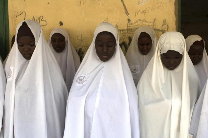 A group of Nigerian Muslim girls pray at an Islamic school.