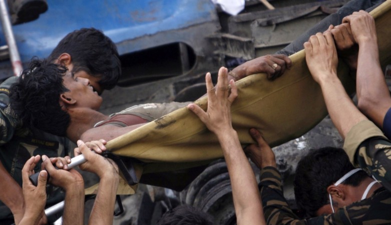An injured passenger being moved from an overturned carriage of a train. Representative image. Reuters file