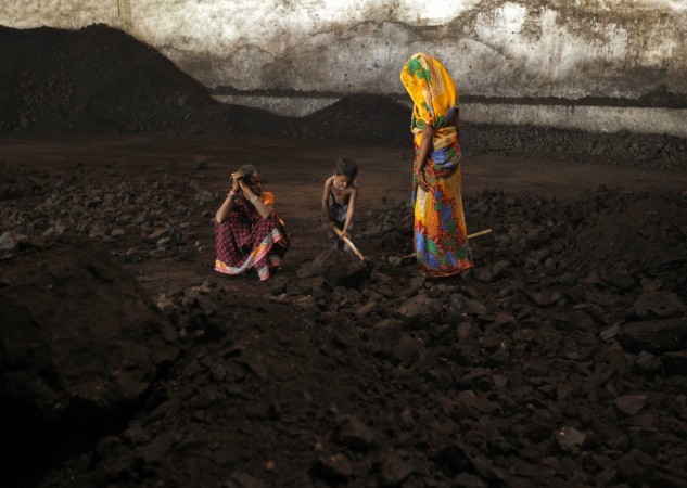Workers at a coal loading bay