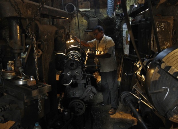 A man works inside a bridge component manufacturing unit in Kolkata