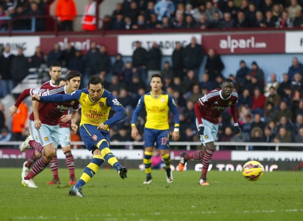 Arsenal playmaker Santi Cazorla scores a penalty against West Ham in their English Premier League game Santi Cazorla Arsenal West Ham