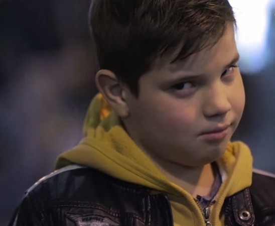 Young boys are asked to slap a girl. Young Boys are asked to slap a girl