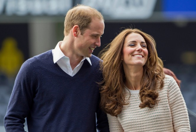 Catherine (R), Duchess of Cambridge, and her husband, Britain's Prince William, laugh as they watch a young players' rugby tournament held at Forsyth Barr Stadium in Dunedin on 13 April 13 2014. Kate Middleton and Prince William