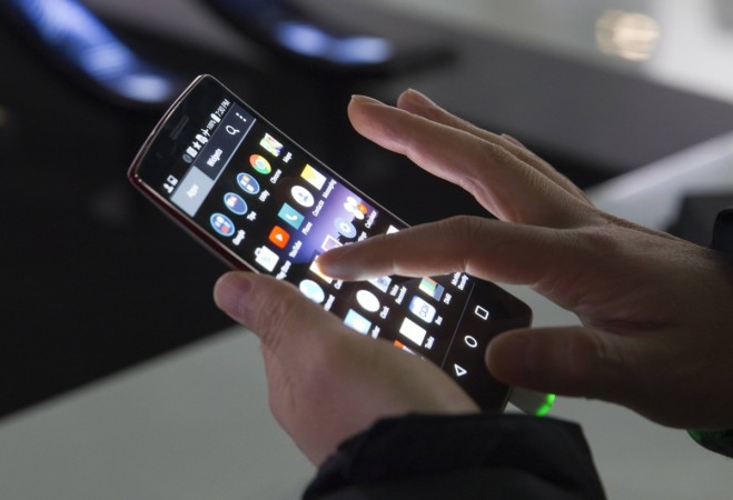 An attendee tries out a LG G Flex 2 curved smartphone during the 2015 International Consumer Electronics Show (CES) in Las Vegas, Nevada An attendee tries out a LG G Flex 2 curved smartphone during the 2015 International Consumer Electronics Show (CES) in Las Vegas, Nevada