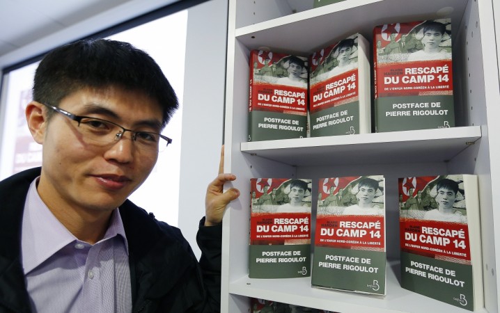 Shin Dong-hyuk poses before a news conference to present the book Shin Dong-hyuk with 'Escape from Camp 14'