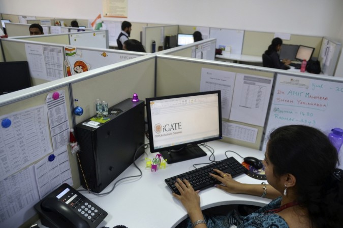 An employee works at the Indian headquarters of iGate in the southern Indian city of Bangalore. IT Employee