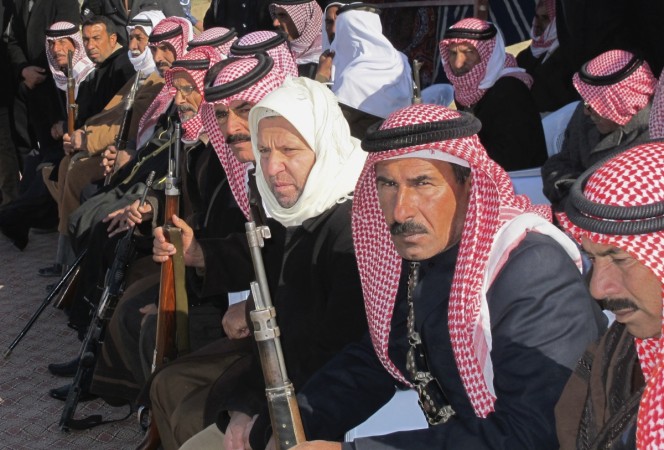 Sunni volunteers carry weapons during a parade as they prepare to fight against militants of the Islamic State, in the town of Amriyat al-Falluja in Anbar province, January 8, 2015. Sunni volunteers carry weapons during a parade as they prepare to fight against militants of the Islamic State, in the town of Amriyat al-Falluja in Anbar province, January 8, 2015.