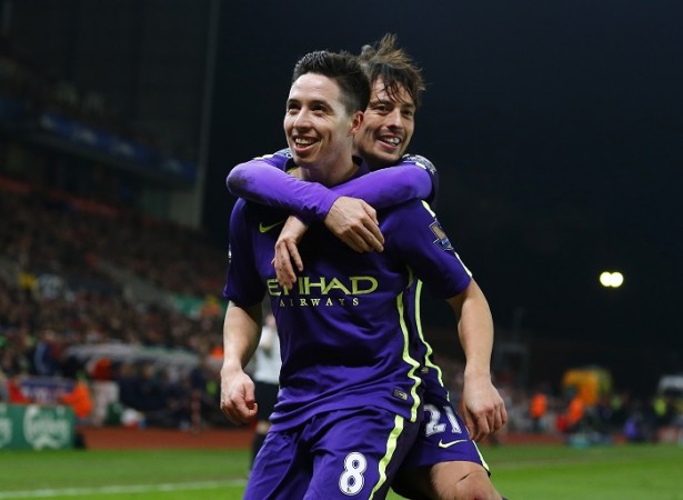Manchester City's Samir Nasri celebrates scoring against Stoke City with David Silva during their English Premier League match at the Britannia Stadium Samir Nasri