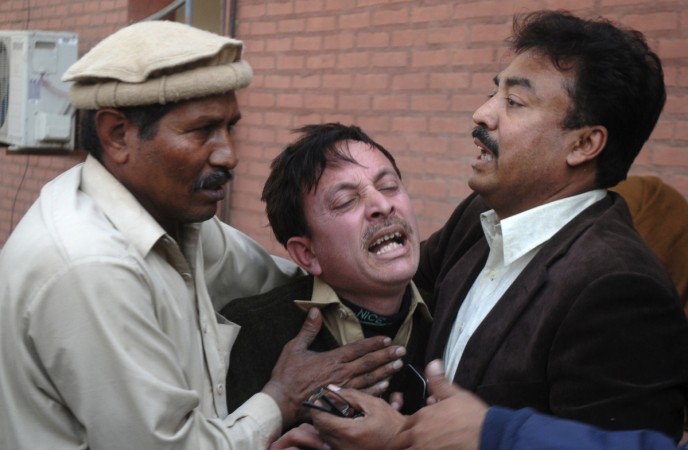 A man cries over the death of his relative, who was killed in an explosion in a Shi'ite mosque, outside a hospital in Peshawar February 13, 2015. A man cries over the death of his relative, who was killed in an explosion in a Shi'ite mosque, outside a hospital in Peshawar February 13, 2015.