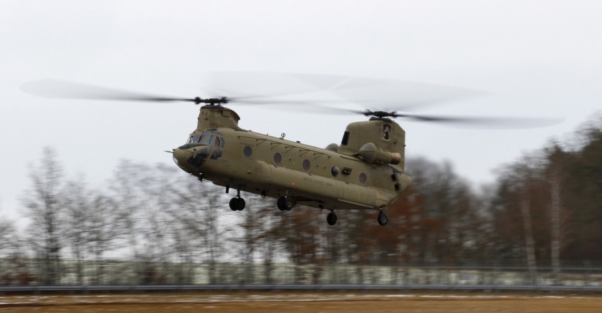 A CH-47 'Chinook' helicopter lands during an exercise at the U.S. military base in Grafenwoehr February 10, 2014. CH-47 'Chinook' helicopter