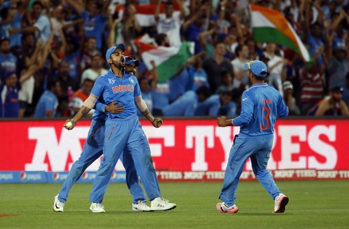 Virat Kohli celebrates with his India teammates after taking the catch to dismiss Pakistan batsman Shahid Afridi in their World Cup match Virat Kohli India vs Pakistan World Cup 2015