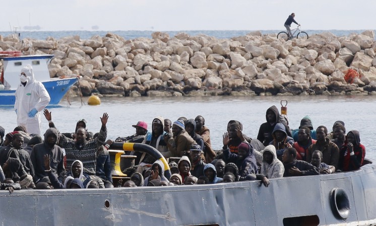Migrants arrive by boat at the Sicilian harbour of Pozzallo, Italy on February 15, 2015 Migrants arrive by boat at the Sicilian harbour of Pozzallo, February 15, 2015
