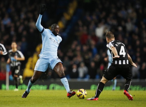 Toure in action during Manchester City's Premier League clash against Newcastle United Yaya Toure