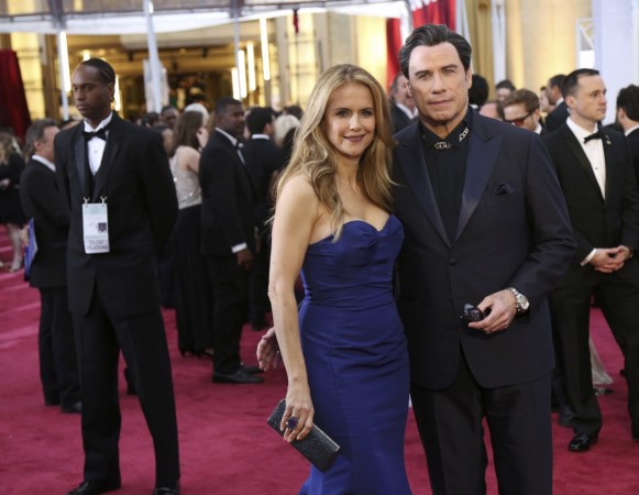 Actor John Travolta and wife Kelly Preston arrive at the 87th Academy Awards in Hollywood Oscars 2015