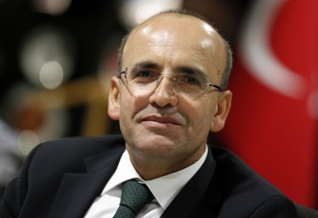 Turkey's Finance Minister Mehmet Simsek poses after an interview with Reuters in Ankara September 5, 2012. Turkey is highly likely to miss its budget deficit target of 1.5 percent of national output this year as growth slows and tax revenues fall but is looking at corrective measures including spending controls, Finance Minister Simsek told Reuters. Turkey's Finance Minister Mehmet Simsek