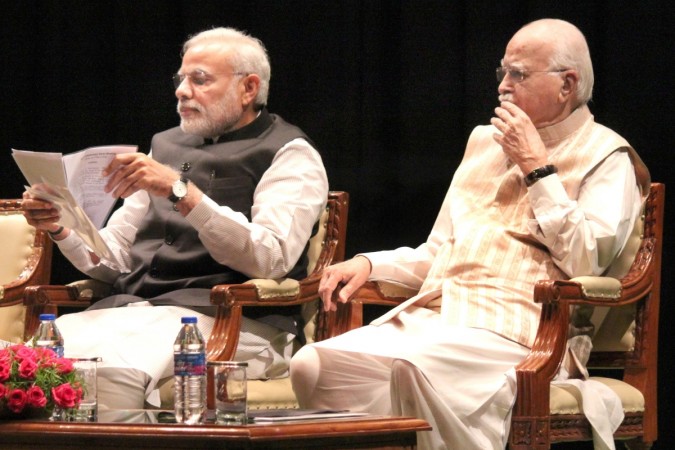 Prime Minister Narendra Modi with veteran BJP leader LK Advani during the the BJP parliamentary party meeting at Parliament library in New Delhi, on March 3, 2015. Narendra Modi