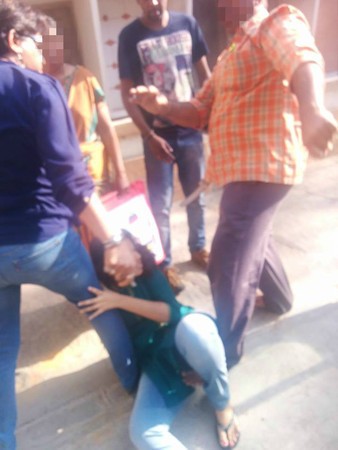 Cop thrashes daughter in public.