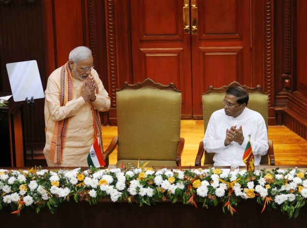 India's Prime Minister Narendra Modi (L) gestures to Sri Lanka's President Maithripala Sirisena after delivering an address at the Presidential Secretariat in Colombo on 13 March, 2015. Modi