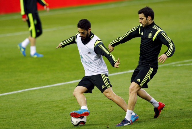 Spanish national soccer team players Isco (L) and Cesc Fabregas attend a training session ahead of their Euro 2016 qualifier against Ukraine in the Andalusian capital of Seville. Isco and Cesc Fabregas